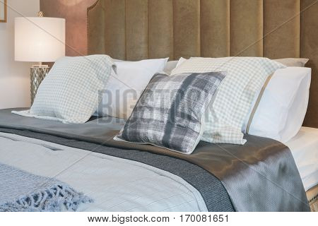 Luxury Decorative Style Bedroom With Checked Pattern Pillows On Bed