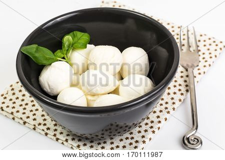 Mini mozzarella balls on white. Studio Photo