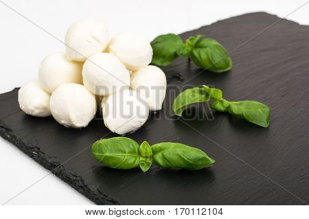 Mini mozzarella balls on white. Studio Photo
