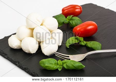 Mini mozzarella balls on white. Studio Photo