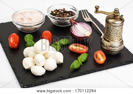 Mini mozzarella balls on white. Studio Photo