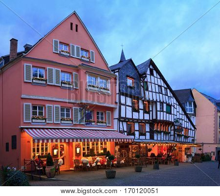 Old street  at Christmas Eve in Bernkastel-Kues, Rhineland-Palatinate, Germany. Toned image
