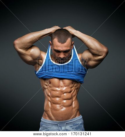Strong Athletic Man Fitness Model Torso showing big muscles and exellent abs