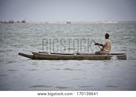 fisherman paddling on the water of Langue de Barbarie, Senegal