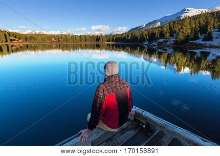 Man on mountains lake