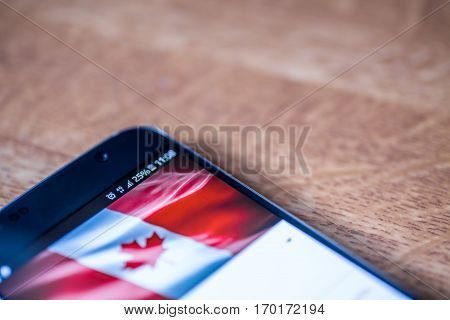 Smartphone With 25 Percent Charge And Canada Flag