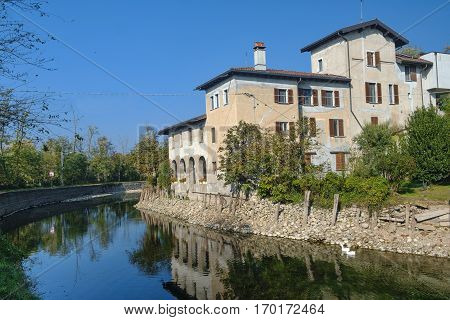 Country house along the Naviglio Grande of Turbigo (Milan Lombardy Italy) at fall with geese