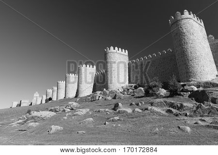 Avila (Castilla y Leon Spain): the famous medieval walls surrounding the city. Black and white
