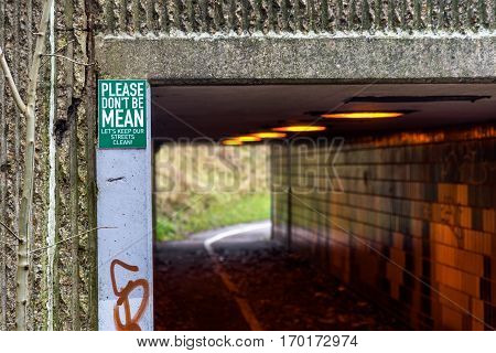 Pedestrian And Ciclyst Path Under Road With A Label Saying - Please Don't Be Mean. Let's Keep Our St