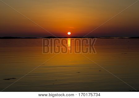 Orange toone Norwegian landscape in the midnight sun
