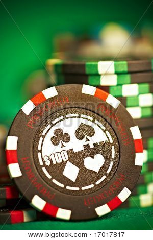 gambling chips on green cloth...