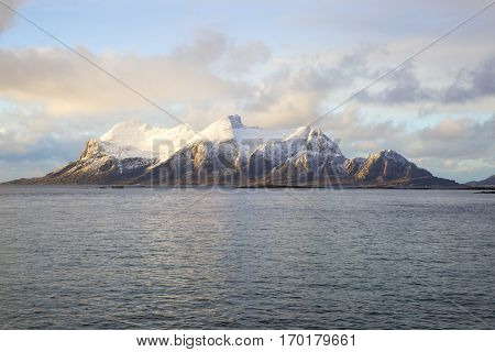 View of a Norwegian fjord with snowy mountains Nordland Norway