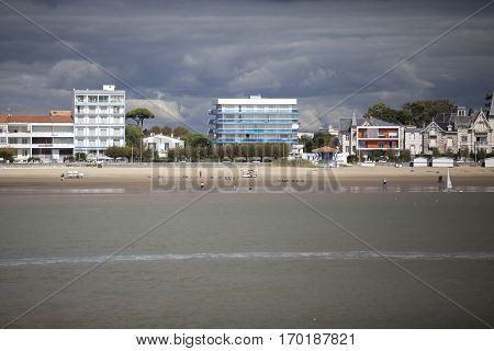 View of the coastline with seaside resort of Royan with grey tourmented sky France
