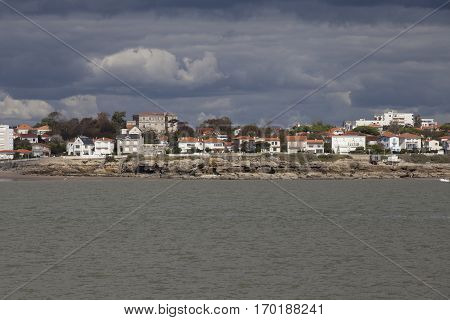 View of the coastline with seaside resort of Royan with grey tourmented sky France