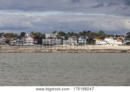 View of the coastline with seaside resort of Royan with grey tourmented sky France