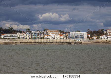 View of the coastline with seaside resort of Royan with grey tourmented sky France