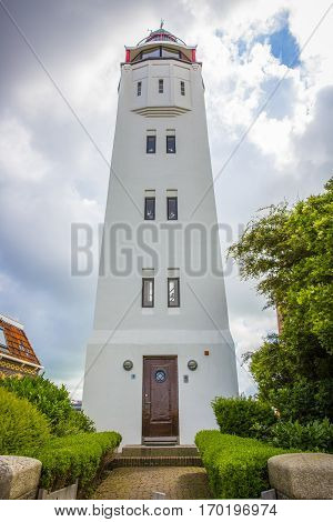 old white lighthouse in Harlingen Friesland the Netherlands