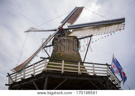 Typical old historical Dutch Windmill in use