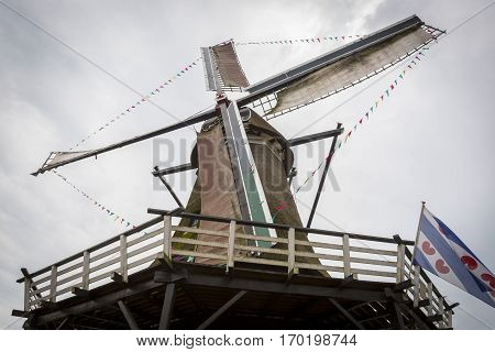 Typical old historical Dutch Windmill in use