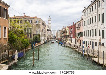 Small typical canal with Chiesa di San Giorgio dei Greci Church bell tower - campanile