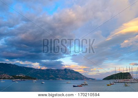 Panoramic View of Budva Coastline, Famous Island of Sveti Nikola and the Dock with Lot of Boats in Budva. Montenegro, Balkans, Adriatic sea, Europe.