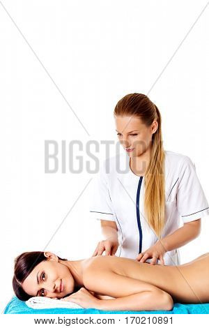 Woman having massage of body in the spa salon. Beauty treatment concept.