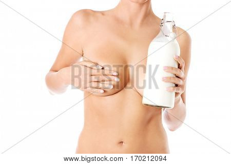Nude woman is holding a ewer of milk. Spa concept.