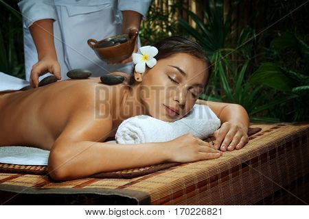 portrait of young beautiful woman in spa environment