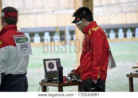 Rio Brazil - august 10 2016: PANG Wei (CHN) during shooting 50m Pistol Men Shooting at Olympic Games 2016 in Olympic Shooting Centre Deodoro