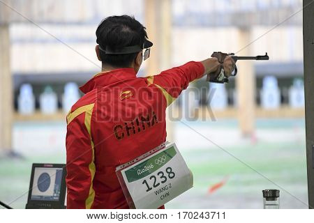 Rio Brazil - august 10 2016: WANG Zhiwei (CHN) during shooting 50m Pistol Men Shooting at Olympic Games 2016 in Olympic Shooting Centre Deodoro