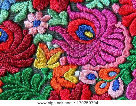 Multicolor floral hand embroidery pattern macro image
