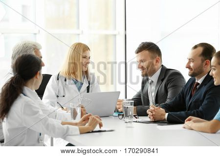 Team of doctors having meeting in clinic
