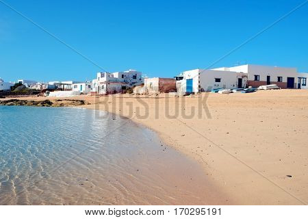a view of a white sand cove in Caleta del Sebo in La Graciosa, Canary Islands, Spain