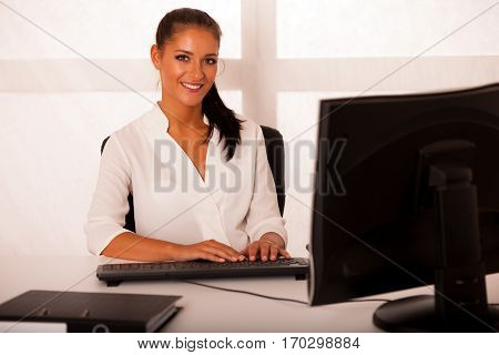 Business Woman Workung On Computer In Office