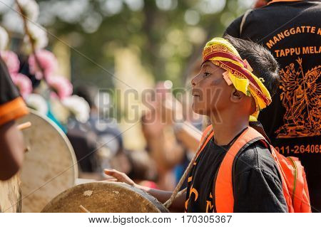 Georgetown Penang Malaysia - February 9 2017 : Young musician boy as a Hindu devotee taking part in the Thaipusam festival on February 9 2017 in Malaysia. Hindu festival to worship God Muruga.
