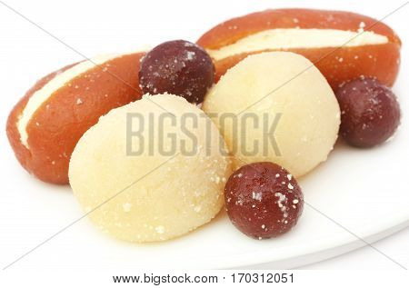 Popular Bangladeshi indian Sweetmeats over white background