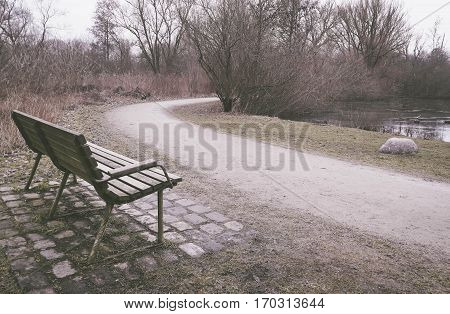 Lonely old wooden bench outdoor in Brunevang Rodovre Denmark