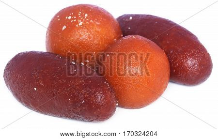 Popular Bangladeshi Sweetmeats Pantua and Kalojam over white background