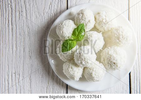 Homemade coconut candies with filling of cream and nut