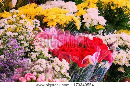 this image is about flower color in market