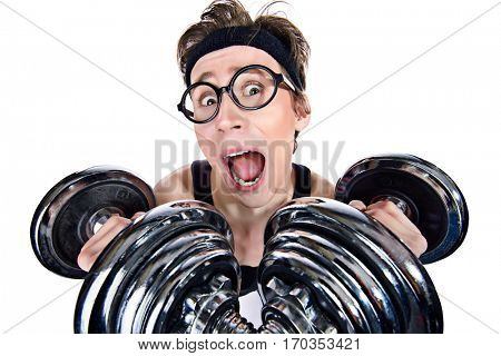 Funny thin man doing exercises with dumbbells. Bodybuilding, muscle building. Sports, activities concept. Isolated over white. 