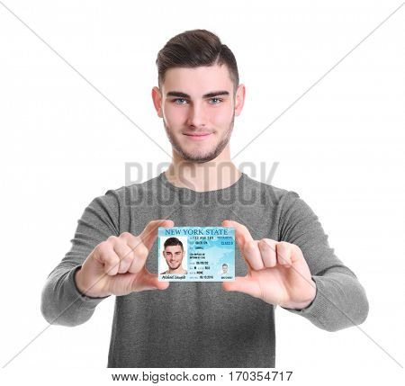 Man with driving license on white background