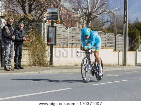 Conflans-Sainte-HonorineFrance-March 62016: The Kazakh cyclist Dmitriy Gruzdev of Astana Team riding during the prologue stage of Paris-Nice 2016.
