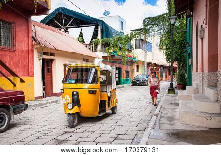 FLORES, GUATEMALA- DEC 22, 2015:  Taxi tuk-tuk at the street of Flores on Dec 22, 2015, Guatemala. 