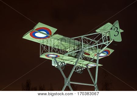 Gatchina Russia - February 10 2016: Fragment of the monument in honor of the 100th anniversary of the first military airport in Russia. Airplane Model Foreman. Night Photography.