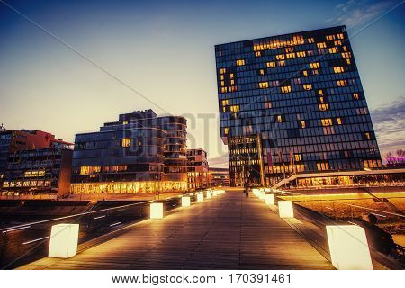 Night city osvitchene neon. Fantastic view of buildings in Germany