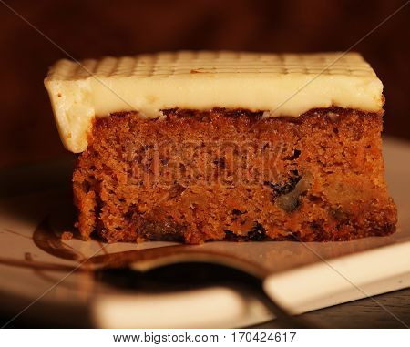 a slice of pumpkin cake on a white plate, tasy dessert