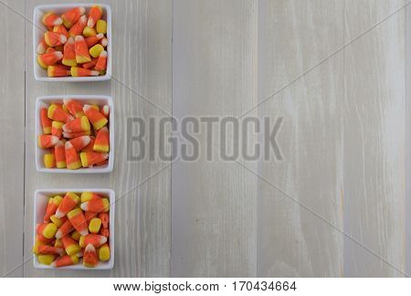 Three Square Bowls of Candy Corn with copy space to right