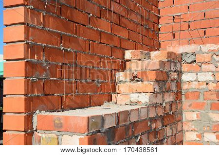 Close up on Bricklaying House Construction Site. Bricklaying Facing Brick Basics Masonry Techniques.How To Lay Bricks Like A Bricklayer. DIY Bricklaying.