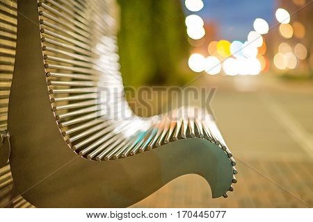 an empty bench in the city park